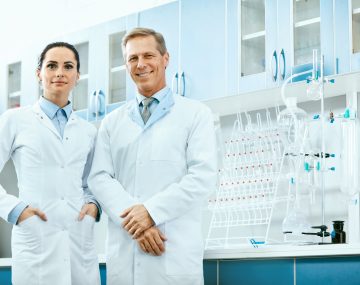 two-scientists-posing-in-a-laboratory